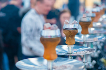 Hookah bar. The bar has many hookahs. Rest in the bar.