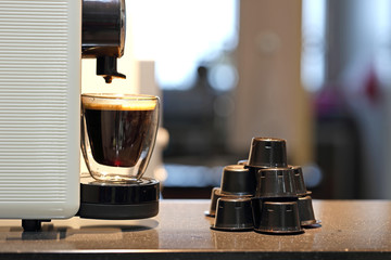 Capsule Coffee Being Brewed from Machine