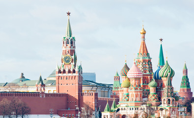 Fototapeta premium Spasskaya Tower of Moscow Kremlin and the Cathedral of Vasily the Blessed (Saint Basil's Cathedral) on Red Square. Sunny winter day. Moscow. Russia
