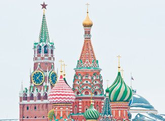 Spasskaya Tower of Moscow Kremlin and the Cathedral of Vasily the Blessed (Saint Basil's Cathedral) on Red Square. Winter day. Moscow. Russia