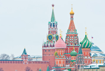 Fototapeta premium Spasskaya Tower of Moscow Kremlin and the Cathedral of Vasily the Blessed (Saint Basil's Cathedral) on Red Square. Winter day. Moscow. Russia