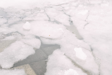 melting ice in the city. broken ice outside