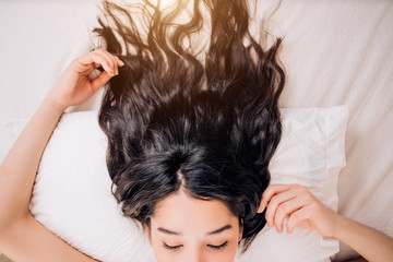 Naklejka premium Portrait pretty young woman on bed