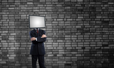 Businessman with TV instead of head.