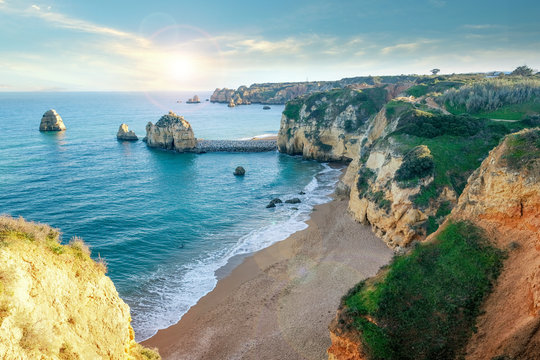  beach among stone cliffs on the shores of the atlantic ocean in the city of Lagos Portugal