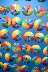 Colorful umbrellas background. Colorful umbrellas in the sky. Street decoration