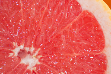 Tasty juicy grapefruit slice close up macro