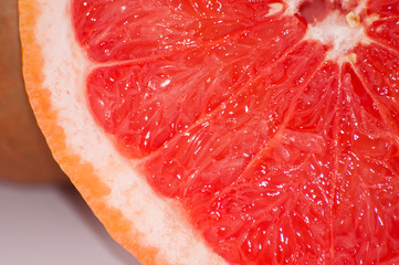 Tasty juicy grapefruit slice close up macro