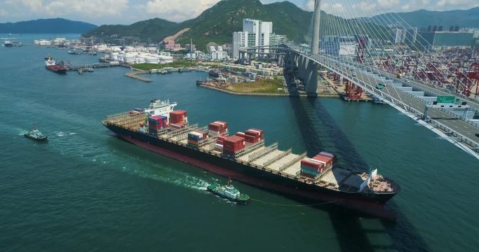 Cargo container ship entering the Hong Kong container terminal top view. Drone shot