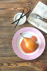 Poached pear on the plate