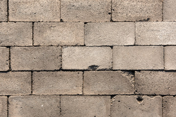 Close-up of the Texture of the Ground Paved with Bricks and Stones