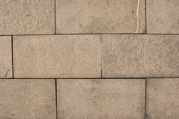 Close-up of the Texture of the Ground Paved with Bricks and Stones