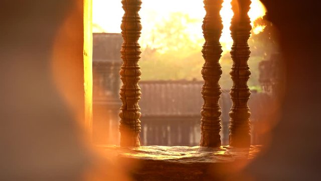 Magic color sun's rays light through the window in Angkor Wat