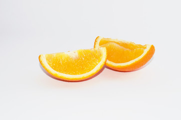 Juicy slices of ripe orange on a white background, isolate