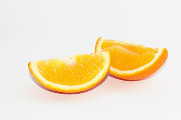 Juicy slices of ripe orange on a white background, isolate