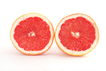 Fototapeta na wymiar Slices of grapefruit macro closeup on white background