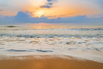 Tropical sea beach at sunrise