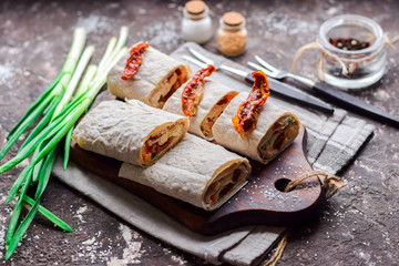 Dried tomatoes with cheese and herbs in pita bread.