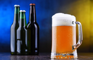 Composition with glass and bottles of beer