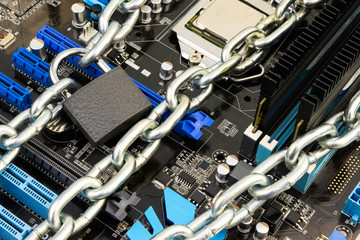 censorship, restrictions and restrictions on a Internet. concept, motherboard in chains under lock...