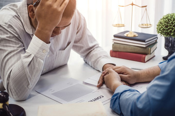 Business man sit strain serious for problem of contract  insurance with lawyers consolation to...