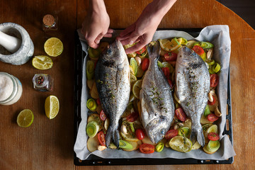fish is prepared for baking in the oven