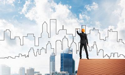 Man architect draw silhouette of modern city on blue sky. Mixed media