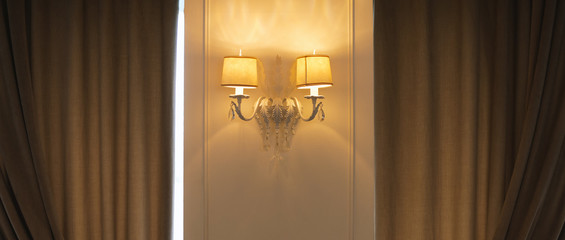 Photo of old background with classic wall lamp in hotel room or restaurant