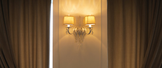 Photo of old background with classic wall lamp in hotel room or restaurant
