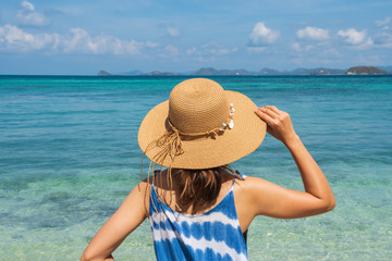 Young woman relaxing and enjoying at the tropical beach, Summer vacation and travel concept