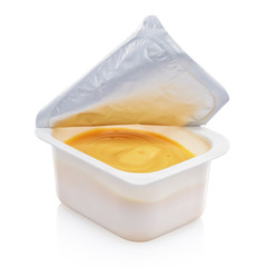 Mustard sauce container isolated