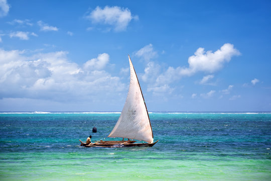 Traditional Zanzibar fishing boat in tropical ocean, Tanzania