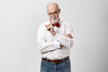 Body language, signs and gestures concept. Portrait of attractive elderly mature bearded...