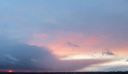 Pink sunset background over the city