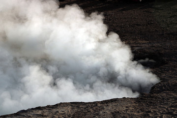 Fototapeta na wymiar Smoke coming from the geysers of el tatio in atacama