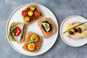 Breakfast toasts with various toppings. Healthy bruschetta. Bread sandwich.