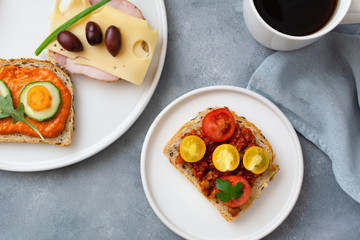 Breakfast toasts with various toppings. Healthy bruschetta. Bread sandwich.