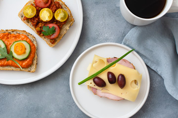 Breakfast toasts with various toppings. Healthy bruschetta. Bread sandwich.