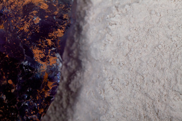 A pile of fluorine spar surrounded by fluorite stones