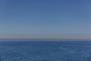 Landscape formed by a beautiful sea and a clear blue sky on a summer day