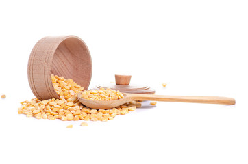 Peas in wooden bowl with lid and wooden spoon on white background isolation