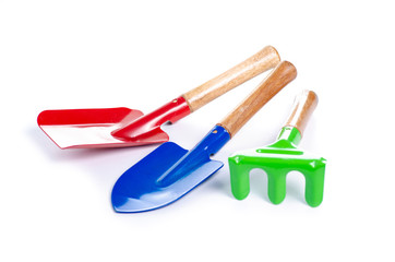 Set of garden rake and shovel on white baclground isolation