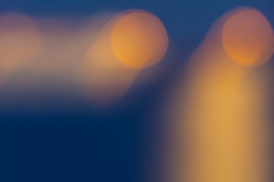 Golden light shining over water defocued