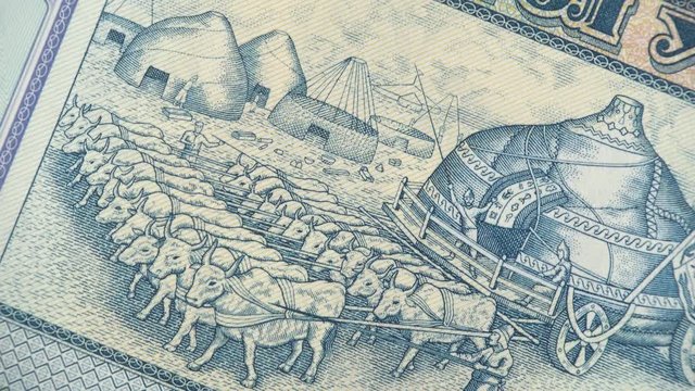 Mongolian yurts in motion on Mongolia 1000 Tugrik banknote rotating. Mongolian currency, money. 4K stock video footage