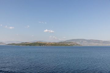 Fototapeta na wymiar Beautiful landscape with a turquoise blue sea and a sailboat sailing on summer