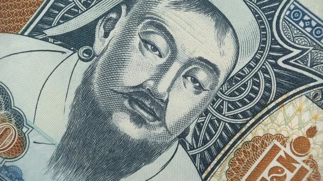 Genghis Khan on Mongolia tugrik banknote rotating. Mongolian currency, money. 4K stock video footage