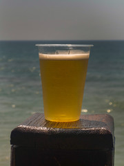 beer with PVC  against the sea of pleasure