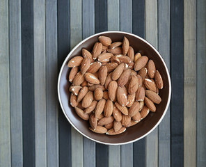 Healthy food  for background image close up almond nuts. Texture Nuts on the cup plate