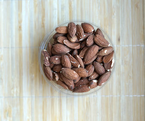 Healthy food  for background image close up almond nuts. Texture Nuts on the cup plate