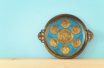 Pesah celebration concept (jewish Passover holiday). Translation for Hebrew Text over plate: (PESAH) PASSOVER